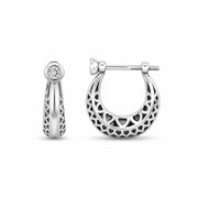 Silver hoop earrings with intricate designs on a white background
